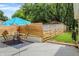 Lush backyard with a well-maintained lawn, wooden fence, and patio at 8019 E Hanna Ave, Indianapolis, IN 46239