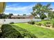 Spacious fenced backyard featuring a lush lawn and garden, perfect for outdoor activities at 8019 E Hanna Ave, Indianapolis, IN 46239