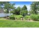 Large backyard featuring a well-tended vegetable garden with mature plants at 8019 E Hanna Ave, Indianapolis, IN 46239