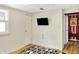 Cozy bedroom featuring a flat-screen TV and closet at 8019 E Hanna Ave, Indianapolis, IN 46239
