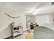 Neutral Bedroom has a ceiling fan, changing table, a white closet and decorative garland at 8019 E Hanna Ave, Indianapolis, IN 46239