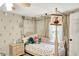 ' bedroom features a four poster bed, floral accents and a neutral color palette at 8019 E Hanna Ave, Indianapolis, IN 46239