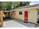 Back of house showing patio, driveway, and rear entrance at 8019 E Hanna Ave, Indianapolis, IN 46239
