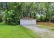 Detached two-car garage with ample parking space, complemented by a well-maintained yard at 8019 E Hanna Ave, Indianapolis, IN 46239