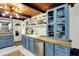 Kitchen featuring blue cabinets, butcher block counters, stainless steel appliances, and ample storage at 8019 E Hanna Ave, Indianapolis, IN 46239
