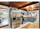 The kitchen features blue cabinets, stainless steel appliances, butcher block countertops, and a unique wood ceiling at 8019 E Hanna Ave, Indianapolis, IN 46239