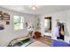 Bright playroom featuring natural light, wall art, and climbing structure at 8019 E Hanna Ave, Indianapolis, IN 46239