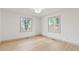 Bright and airy bedroom with two windows and beautiful hardwood floors at 8246 Windcombe Blvd, Indianapolis, IN 46240