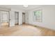 Bright bedroom features hardwood floors, natural light from a window, and closet at 8246 Windcombe Blvd, Indianapolis, IN 46240