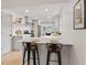Modern kitchen with sleek countertops, bar seating, and stainless steel appliances at 8246 Windcombe Blvd, Indianapolis, IN 46240