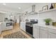 Bright, modern kitchen with stainless steel stove and appliances and quartz countertops at 8246 Windcombe Blvd, Indianapolis, IN 46240