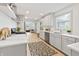 Bright, modern kitchen with stainless steel appliances, quartz countertops, and stylish grey cabinetry at 8246 Windcombe Blvd, Indianapolis, IN 46240