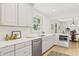 Bright kitchen featuring quartz countertops, stainless steel dishwasher, and modern microwave at 8246 Windcombe Blvd, Indianapolis, IN 46240