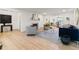 Bright living room featuring hardwood floors, fireplace, and modern decor at 8246 Windcombe Blvd, Indianapolis, IN 46240