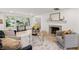 Bright living room featuring large windows, a decorative fireplace, and stylish, comfortable seating at 8246 Windcombe Blvd, Indianapolis, IN 46240