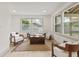 Bright living room with stylish decor, natural light, hardwood floors, and neutral paint at 8246 Windcombe Blvd, Indianapolis, IN 46240