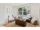 Bright living room with stylish decor, natural light, hardwood floors, and neutral paint at 8246 Windcombe Blvd, Indianapolis, IN 46240
