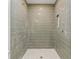 Contemporary shower featuring stylish tile and an integrated niche for toiletries at 8246 Windcombe Blvd, Indianapolis, IN 46240