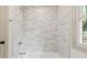 Bathroom shower with tiled surround and modern fixtures at 8246 Windcombe Blvd, Indianapolis, IN 46240
