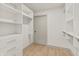Large walk-in closet featuring well-organized shelving and drawers for optimal storage at 8246 Windcombe Blvd, Indianapolis, IN 46240