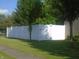 White vinyl privacy fence encloses the backyard, providing security and seclusion at 8301 Wheatfield Dr, Camby, IN 46113