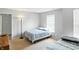 Bright bedroom with two beds, neutral carpet, and a floor lamp at 8301 Wheatfield Dr, Camby, IN 46113
