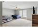Spacious bedroom with a ceiling fan, two beds, large window and natural light at 8301 Wheatfield Dr, Camby, IN 46113