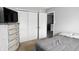Bedroom with neutral walls and carpet, complemented by a sliding door closet and television at 8301 Wheatfield Dr, Camby, IN 46113