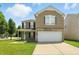 Charming two-story home with a well-maintained lawn and a two-car garage at 8301 Wheatfield Dr, Camby, IN 46113