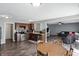 Open concept kitchen with stainless steel appliances and dark wood cabinets at 8301 Wheatfield Dr, Camby, IN 46113