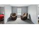 Comfortable living room features two recliners, a neutral color scheme and an abundance of natural light at 8301 Wheatfield Dr, Camby, IN 46113