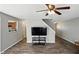 Open concept living room features a large TV and easy kitchen access at 8301 Wheatfield Dr, Camby, IN 46113