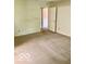 Bedroom with neutral carpet and a door to another room at 8326 Alcona Dr, Indianapolis, IN 46237