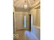 Inviting entryway with a well-lit foyer and classic paneled front door with side lights at 8326 Alcona Dr, Indianapolis, IN 46237