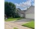 Well-maintained home with lush lawn, mature trees, and a convenient two-car garage at 8326 Alcona Dr, Indianapolis, IN 46237