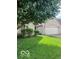 Charming brick home featuring an attached two-car garage and beautifully manicured front yard at 8326 Alcona Dr, Indianapolis, IN 46237