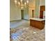 Bright kitchen with a central island and chandelier lighting at 8326 Alcona Dr, Indianapolis, IN 46237