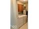 Laundry room with washer, dryer, and overhead cabinets for storage at 8326 Alcona Dr, Indianapolis, IN 46237