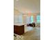Open living area featuring an island, abundant natural light, and sliding glass door at 8326 Alcona Dr, Indianapolis, IN 46237