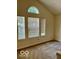 Bright living room filled with natural light from three windows and complemented by neutral walls at 8326 Alcona Dr, Indianapolis, IN 46237