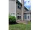 Back exterior featuring vinyl siding and a sliding door with covered patio at 8333 Pine Branch Ln, Indianapolis, IN 46234