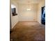 Spacious dining room with a modern chandelier, neutral walls, and carpet flooring, providing an inviting space for meals and gatherings at 8333 Pine Branch Ln, Indianapolis, IN 46234