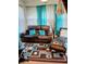 Comfortable living room features a leather recliner sofa, tufted ottoman, and a patterned rug, creating a cozy and stylish space at 8333 Pine Branch Ln, Indianapolis, IN 46234
