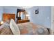 This bedroom features a large bed, wooden furniture, and blue walls at 9042 Panorama Ct, Indianapolis, IN 46234