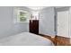 Comfortable bedroom featuring hardwood floors, soft lighting, and fresh paint at 9042 Panorama Ct, Indianapolis, IN 46234