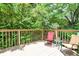Relaxing deck space with comfortable seating, a side table, and a garden view, perfect for enjoying the outdoors at 9042 Panorama Ct, Indianapolis, IN 46234