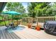 Spacious deck featuring a dining set, flowers, and a grill, perfect for outdoor dining and entertaining guests at 9042 Panorama Ct, Indianapolis, IN 46234