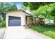 Well-maintained single-story home with attached garage and cozy front porch at 9042 Panorama Ct, Indianapolis, IN 46234