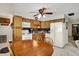 Well-equipped kitchen with wood cabinets, modern appliances, and dining area at 9042 Panorama Ct, Indianapolis, IN 46234