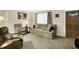 Cozy living room with plush seating, soft carpet, and natural light at 9042 Panorama Ct, Indianapolis, IN 46234